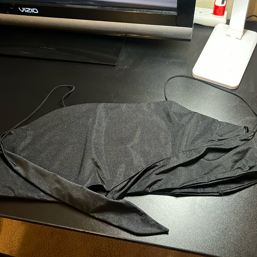 Silky material, thing straps with ties for the back, never worn!